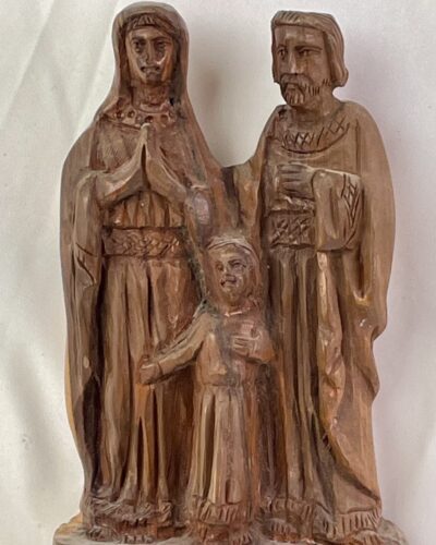 Hand carved primitive statue of the holy family